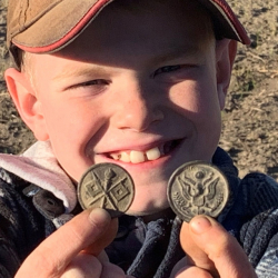 WWI eagle coat button and the Signal Corps Collar Disc, found by Kye "Pvt. Pup" S.